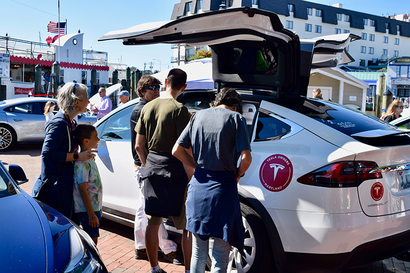 People check out Electric Vehicles, including this Tesla Model X at Annapolis NDEW Kick Gas EV Showcase Sept 2021