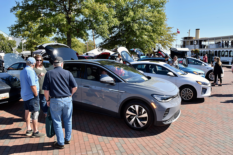 People check out many EV models including this VW ID.4 at Annapolis NDEW Kick Gas EV Showcase Sept 2021